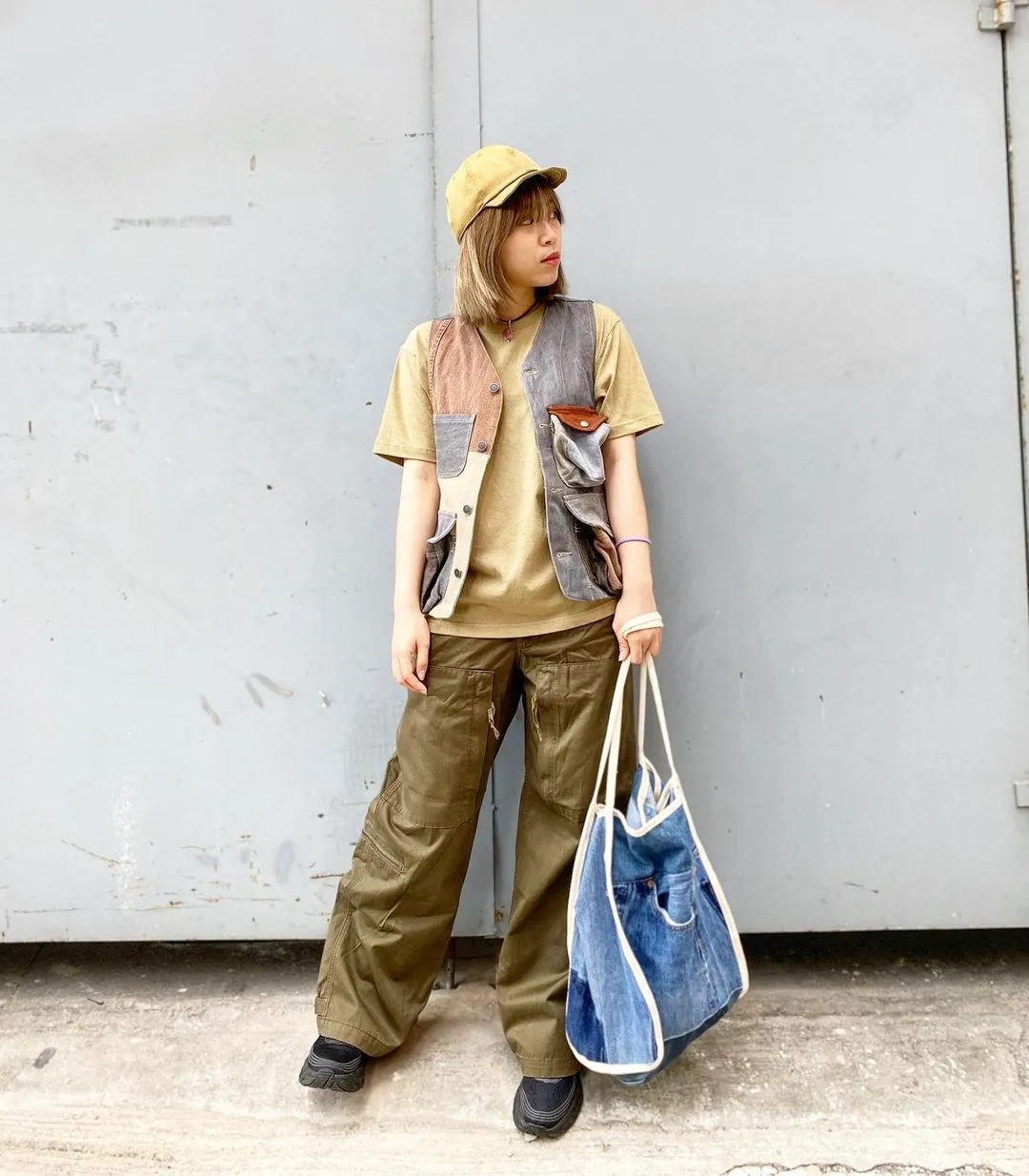 First Edition patchwork hunting vest, styled with olive trousers and a denim tote